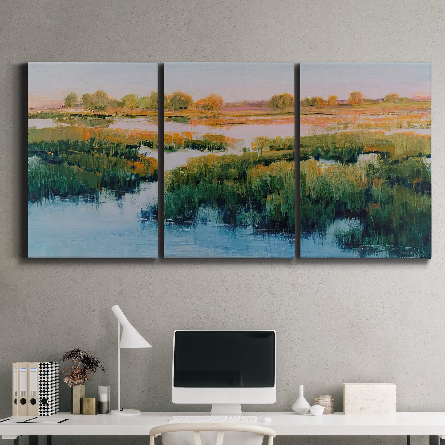 Three-panel canvas wall art featuring pastoral marshland landscape, displayed above a desk in a home office.