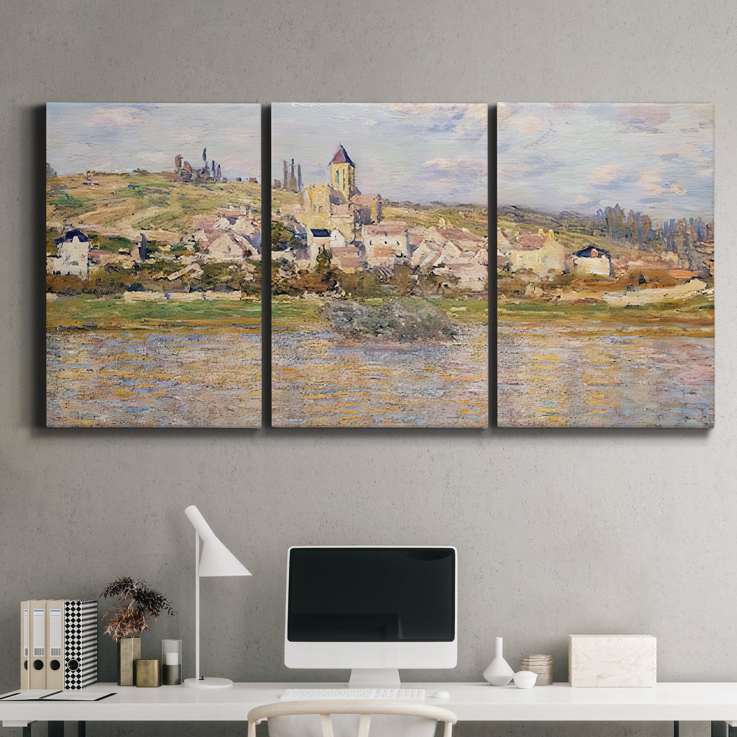 Three-panel canvas wall art featuring village overlooking river valley, displayed above a desk in a home office.