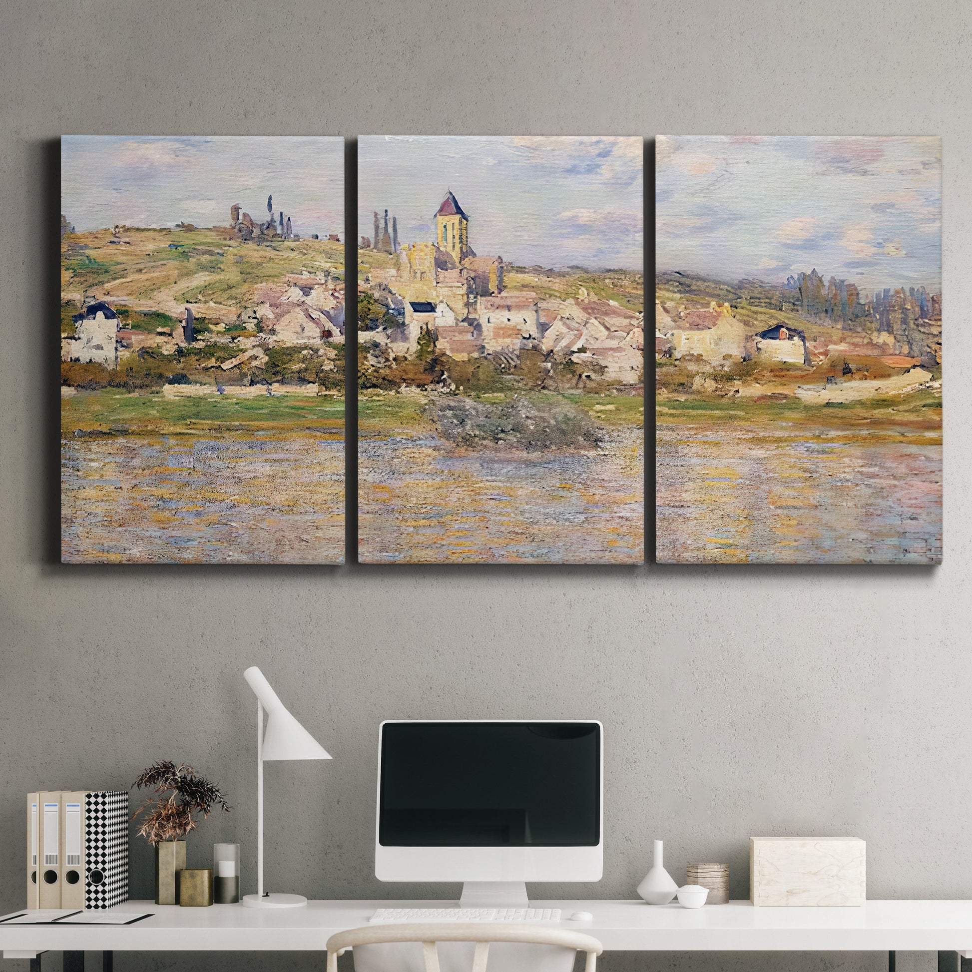 Three-panel canvas wall art featuring village overlooking river valley, displayed above a desk in a home office.