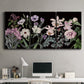 Three-panel canvas wall art featuring early spring blossoms in soft tones, displayed above a desk in a home office.