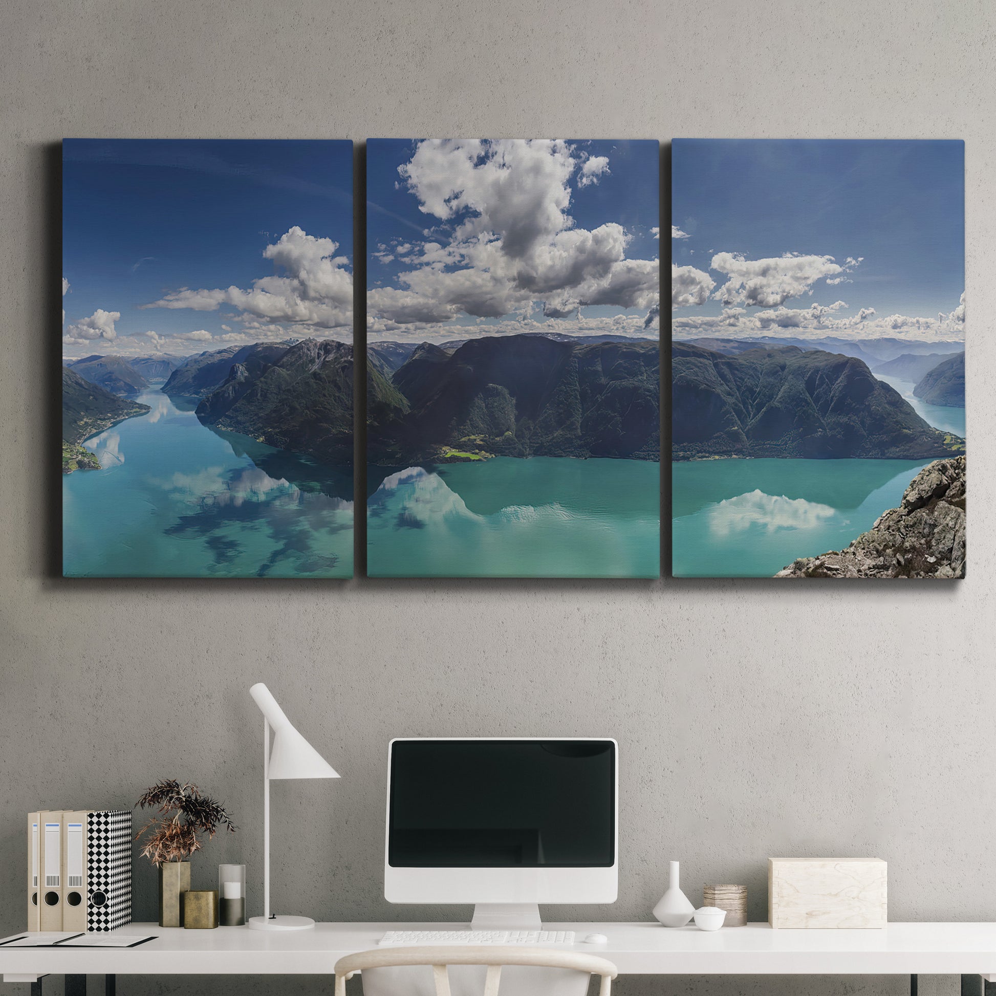 Three-panel canvas wall art featuring tropical water reflections with foliage, displayed above a desk in a home office.