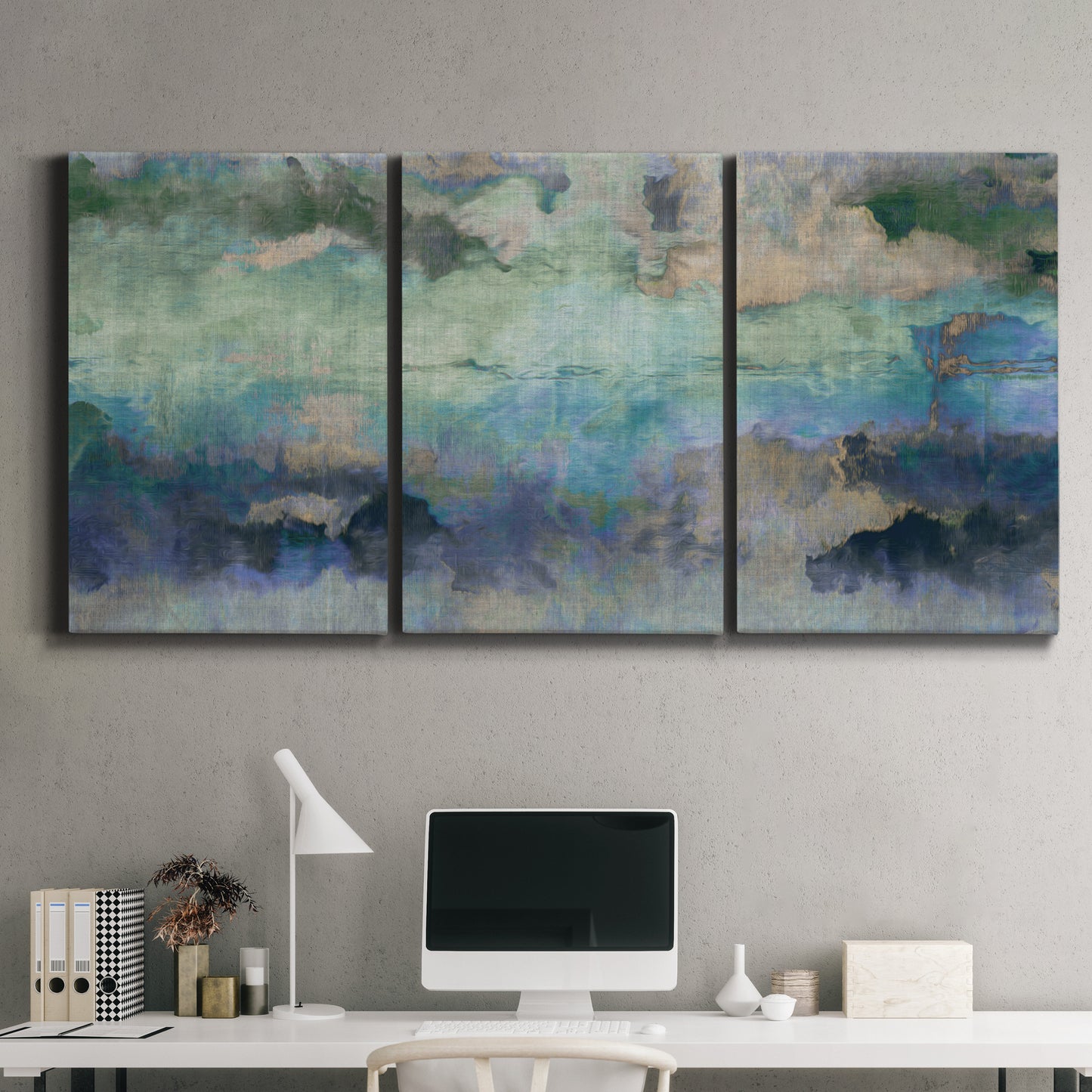Three-panel canvas wall art featuring cool dreamy abstraction, displayed above a desk in a home office.