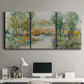 Three-panel canvas wall art featuring trees lining quiet creek, displayed above a desk in a home office.
