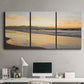 Three-panel canvas wall art featuring quiet tropical shoreline at low tide, displayed above a desk in a home office.