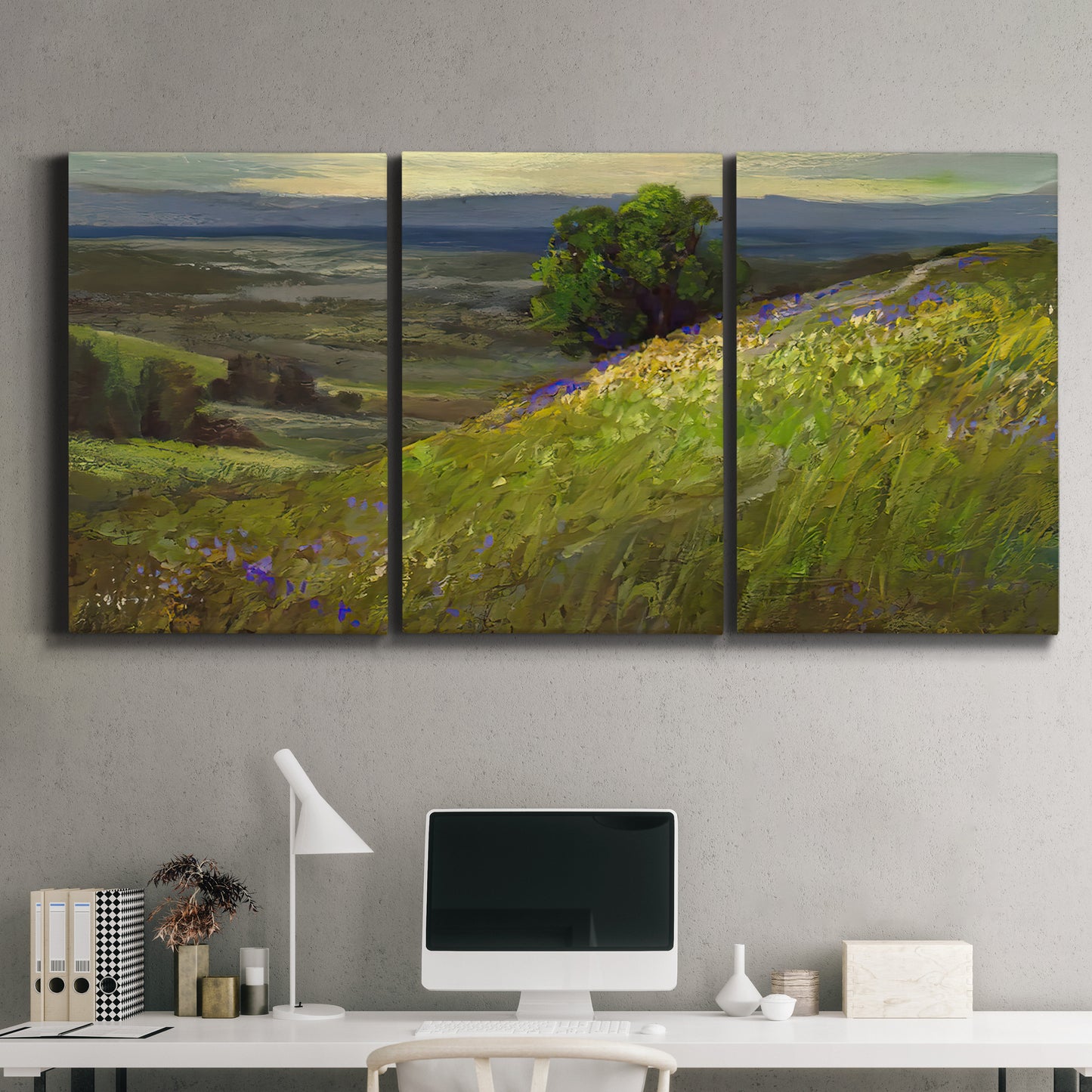 Three-panel canvas wall art featuring winding path through rolling hills, displayed above a desk in a home office.