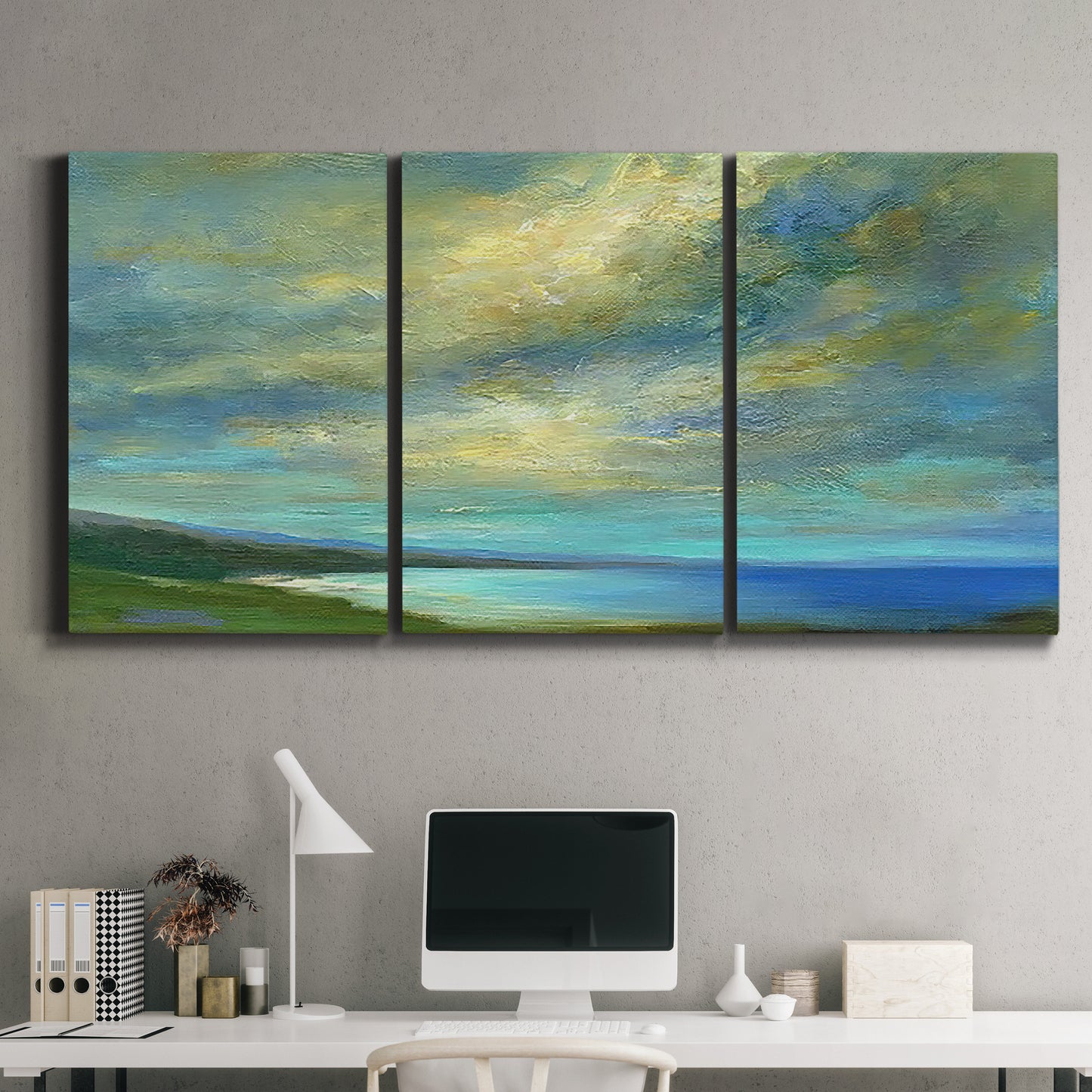 Three-panel canvas wall art featuring coastal shoreline with soft waves, displayed above a desk in a home office.