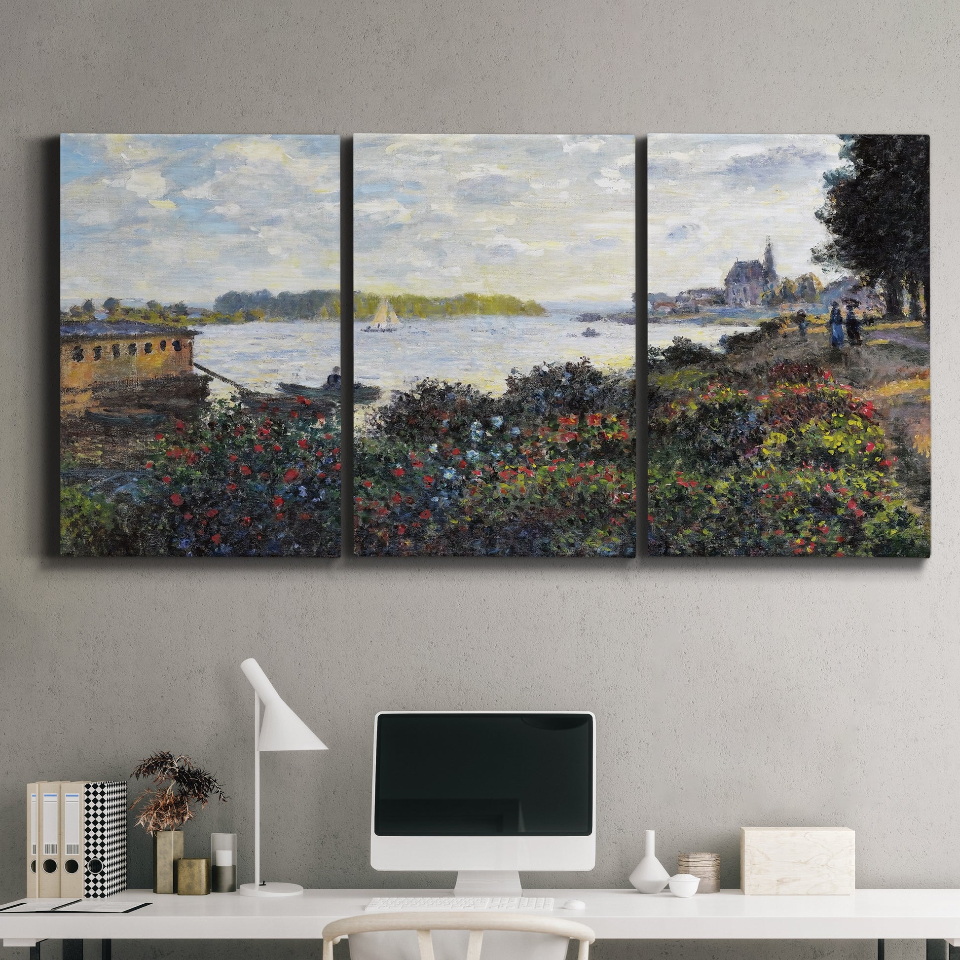 Three-panel canvas wall art featuring river with boats and shoreline, displayed above a desk in a home office.