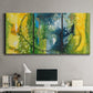 Three-panel canvas wall art featuring energetic abstract aquatic color motion, displayed above a desk in a home office.