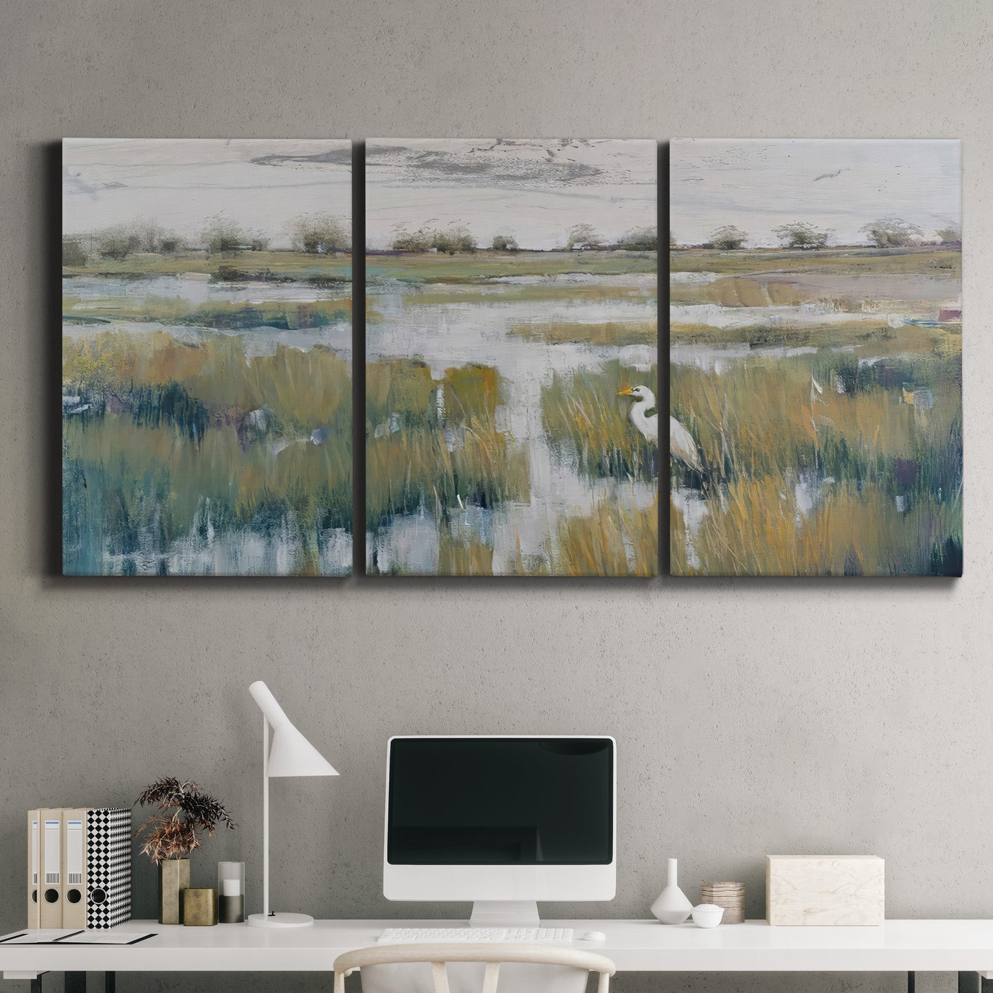 Three-panel canvas wall art featuring pastoral marshland landscape, displayed above a desk in a home office.
