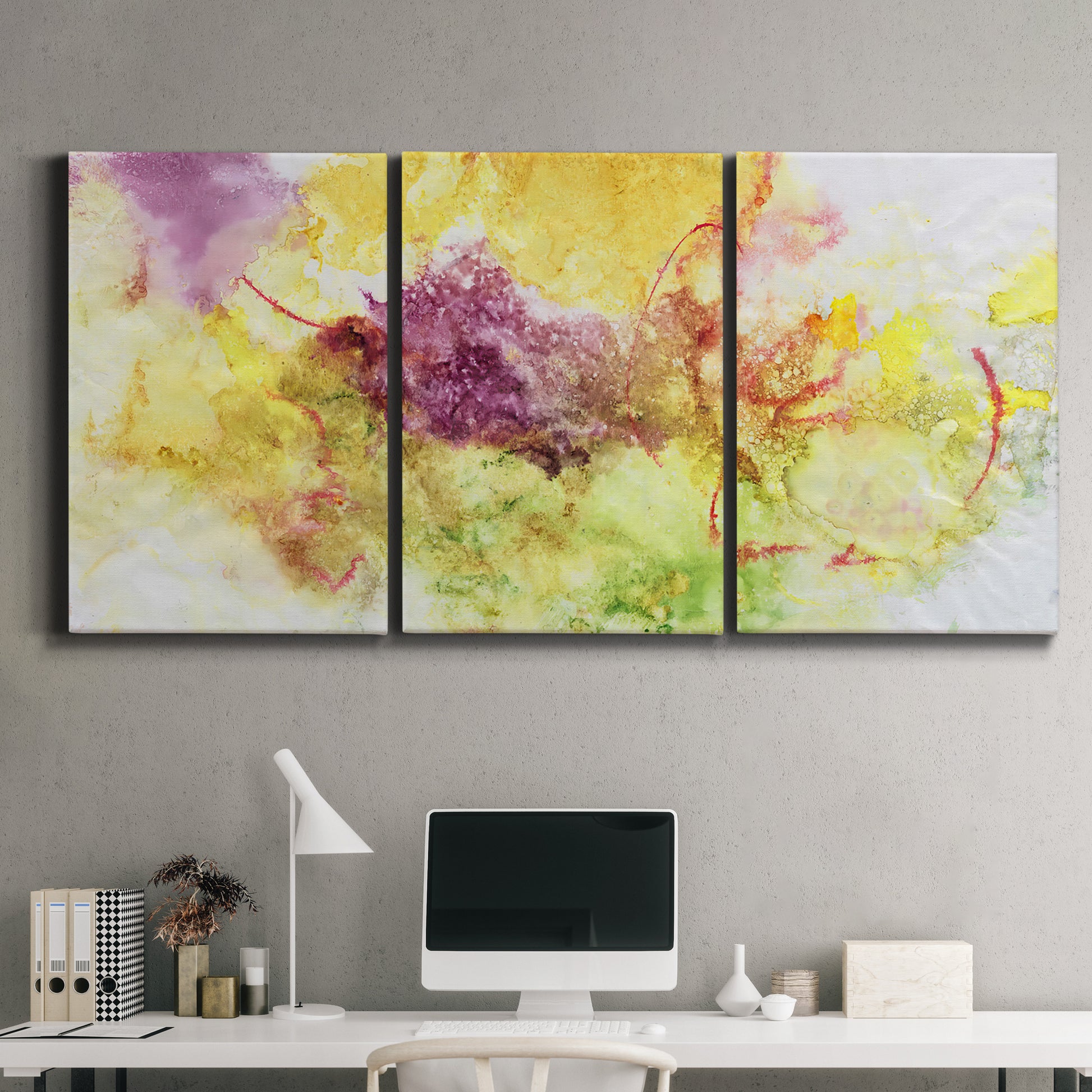 Three-panel canvas wall art featuring abstract floral rhythm composition, displayed above a desk in a home office.
