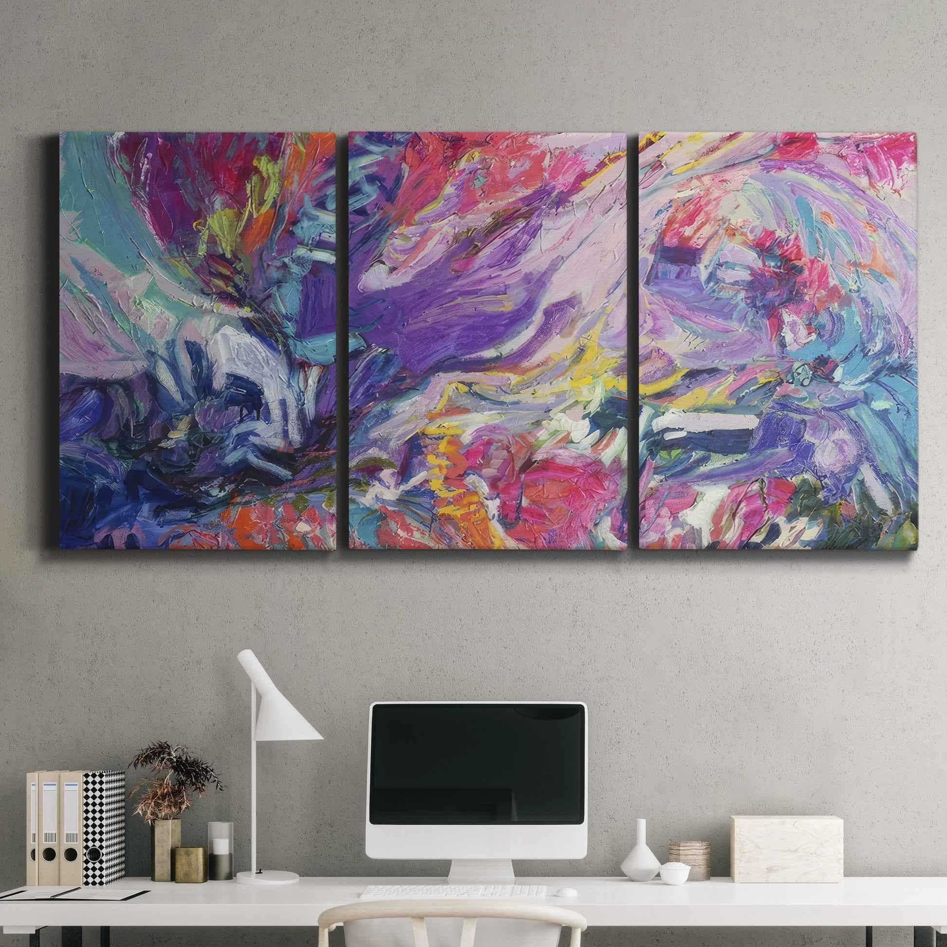 Three-panel canvas wall art featuring expressive abstract with layered color, displayed above a desk in a home office.