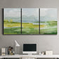 Three-panel canvas wall art featuring lowland wetlands with reflective water, displayed above a desk in a home office.