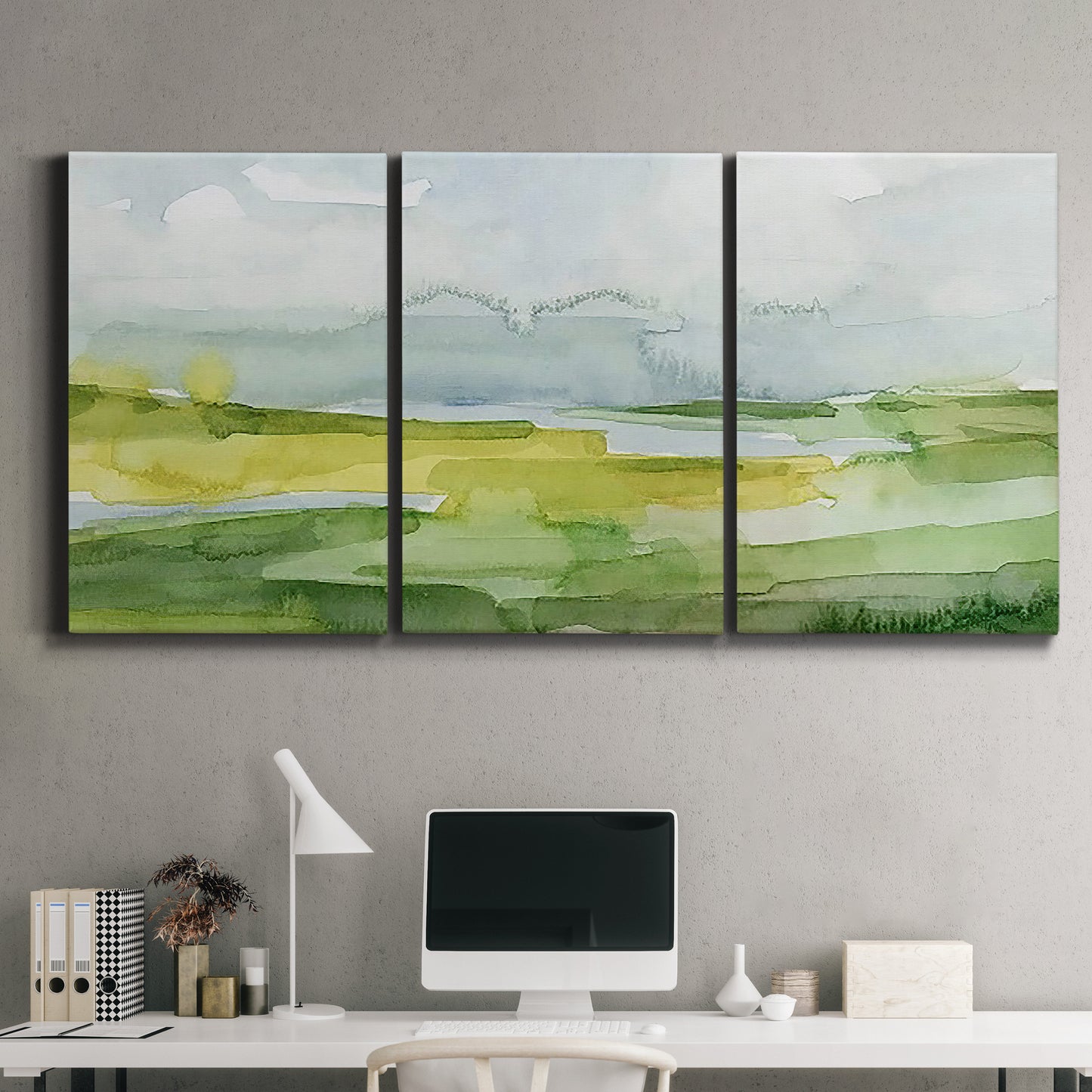 Three-panel canvas wall art featuring lowland wetlands with reflective water, displayed above a desk in a home office.