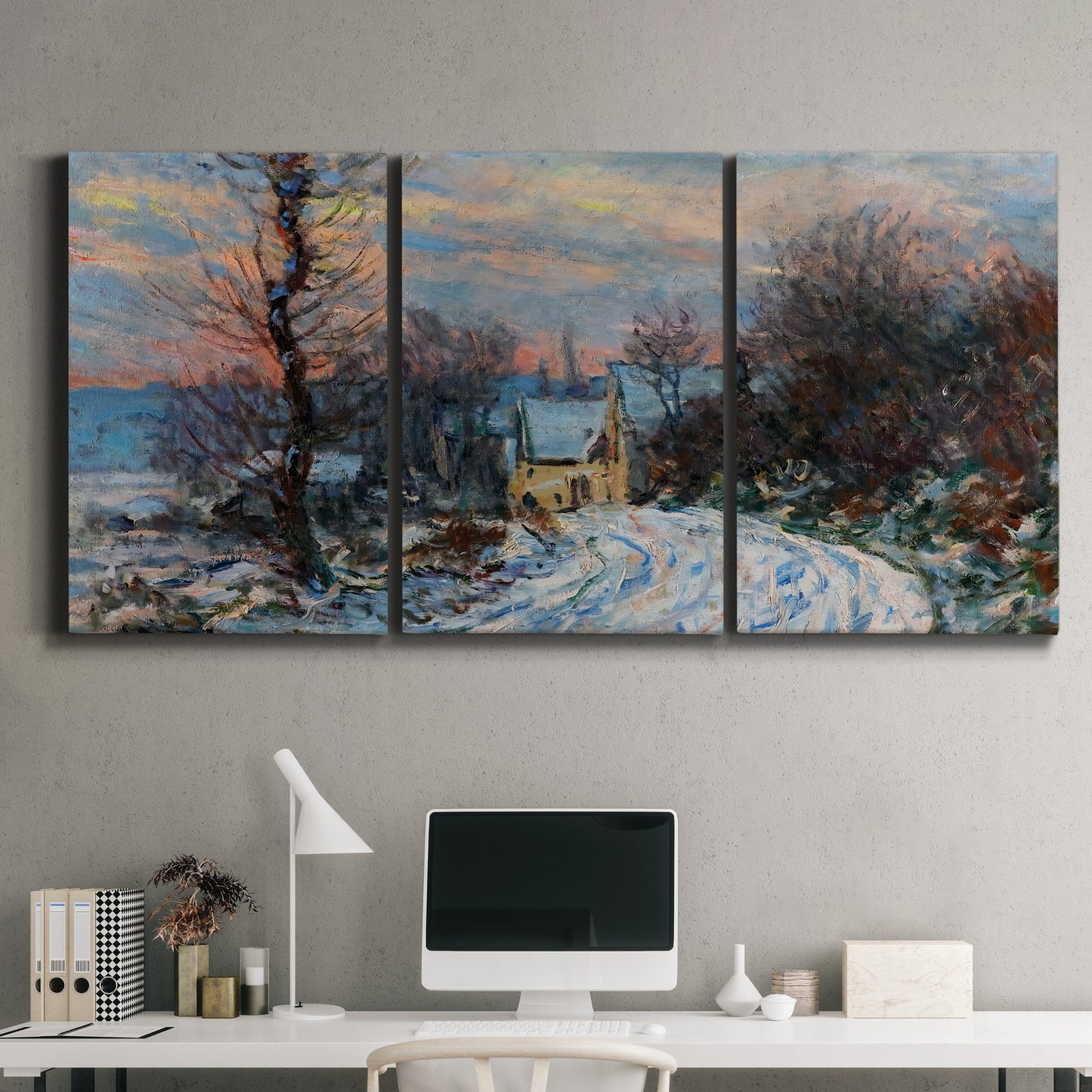 Three-panel canvas wall art featuring snow covered road leading to village, displayed above a desk in a home office.