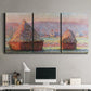 Three-panel canvas wall art featuring winter grainstacks glowing at sunset, displayed above a desk in a home office.