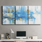 Three-panel canvas wall art featuring blue toned abstract city rhythm, displayed above a desk in a home office.