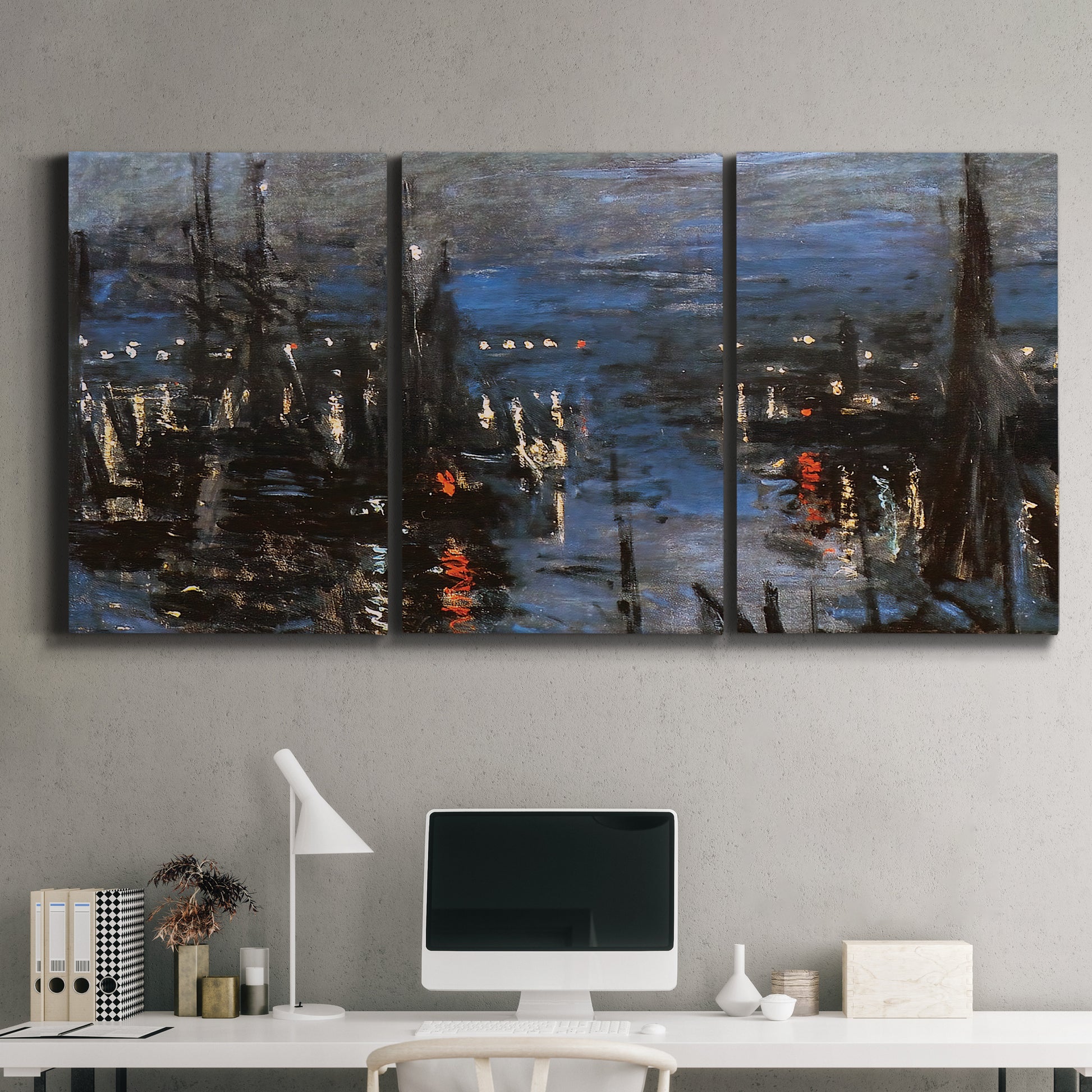 Three-panel canvas wall art featuring Le Havre port at night with lights, displayed above a desk in a home office.