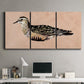 Three-panel canvas wall art featuring coastal bird illustration, displayed above a desk in a home office.