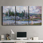 Three-panel canvas wall art featuring summer village view along river, displayed above a desk in a home office.