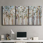 Three-panel canvas wall art featuring bare birch trees in winter forest, displayed above a desk in a home office.