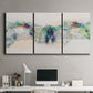 Three-panel canvas wall art featuring abstract mountain range watercolor, displayed above a desk in a home office.