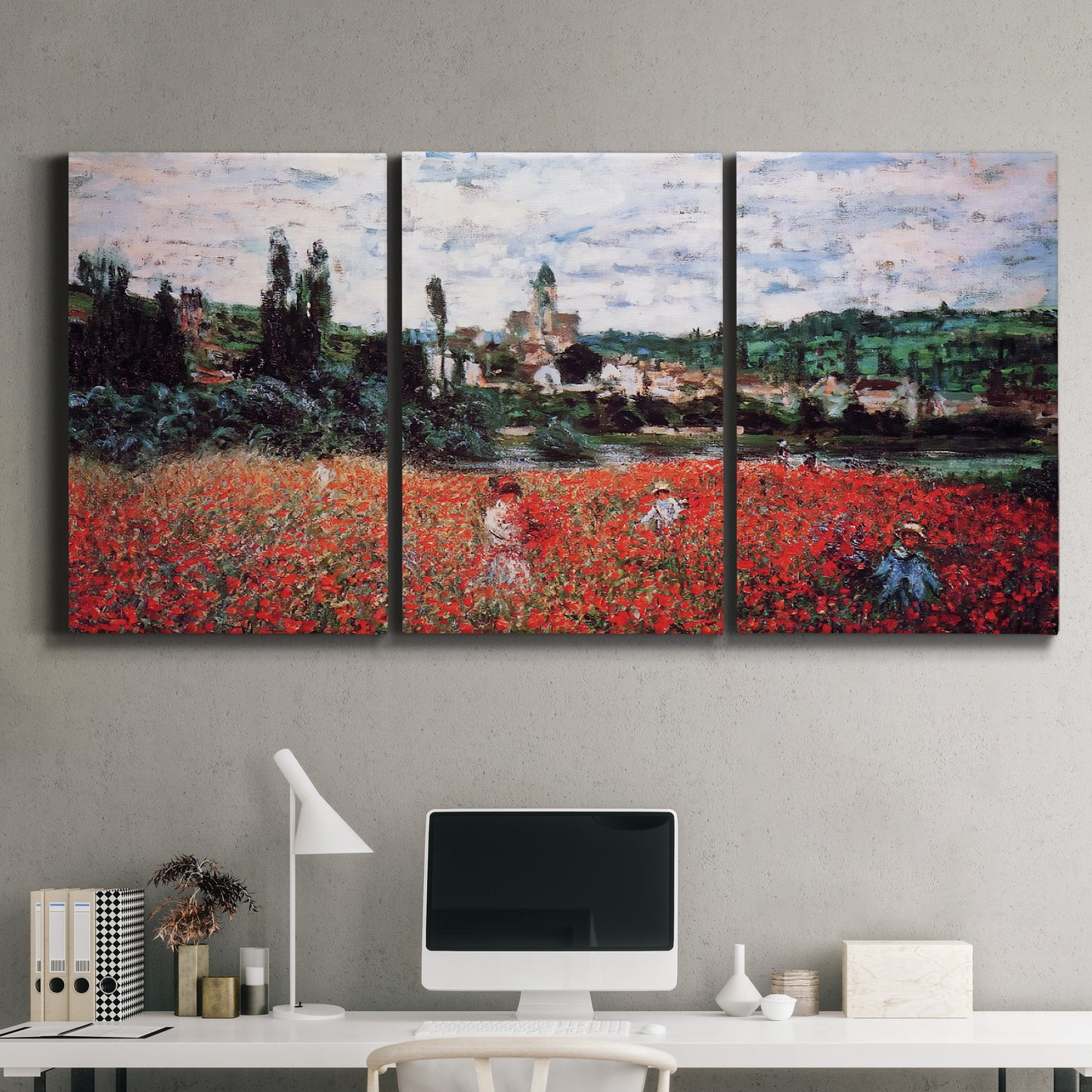 Three-panel canvas wall art featuring poppy field beside village landscape, displayed above a desk in a home office.