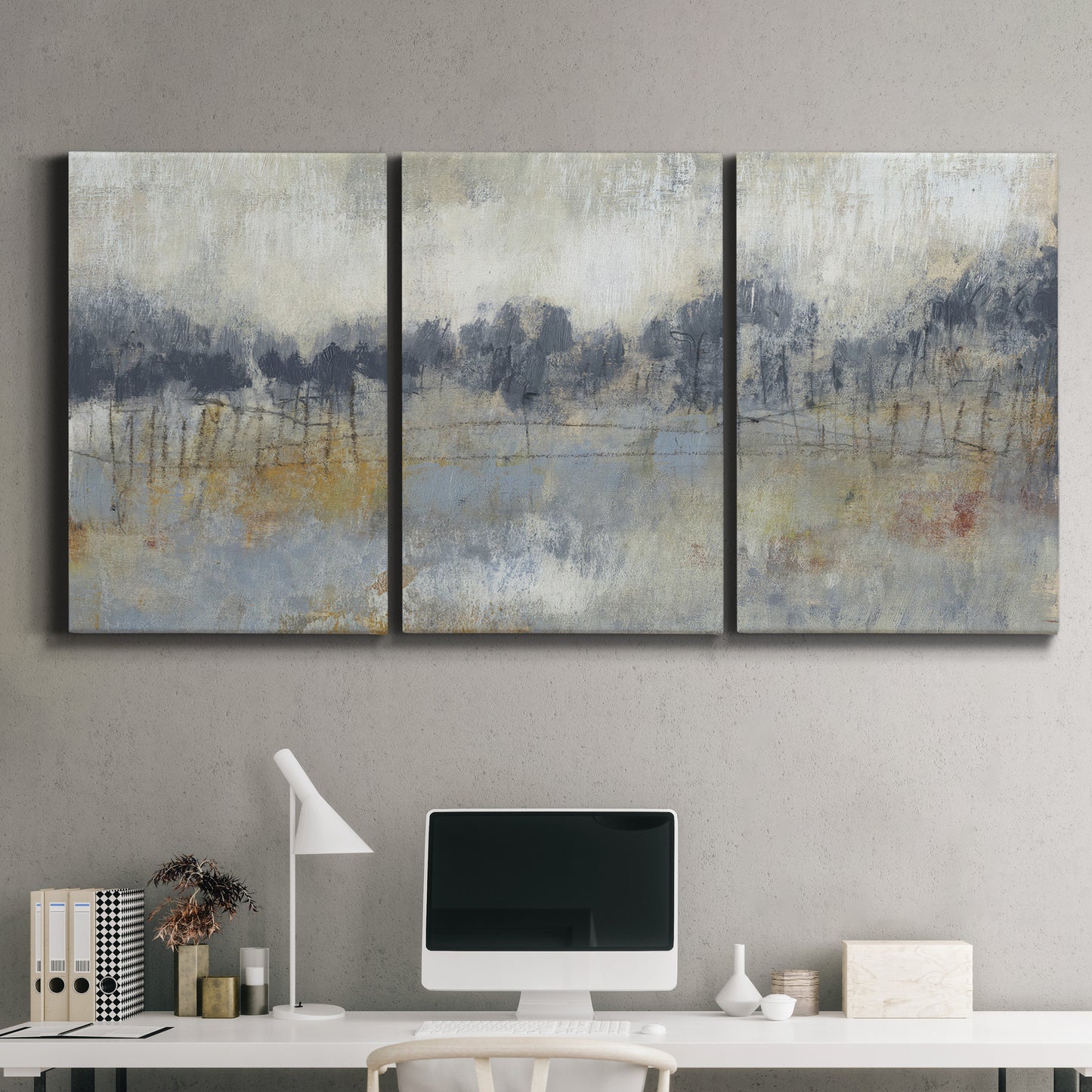 Three-panel canvas wall art featuring soft grey abstract horizon, displayed above a desk in a home office.