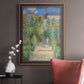 Impressionist garden landscape painting by Claude Monet in an ornate bronzed mahogany wood frame displayed in a neutral interior setting.