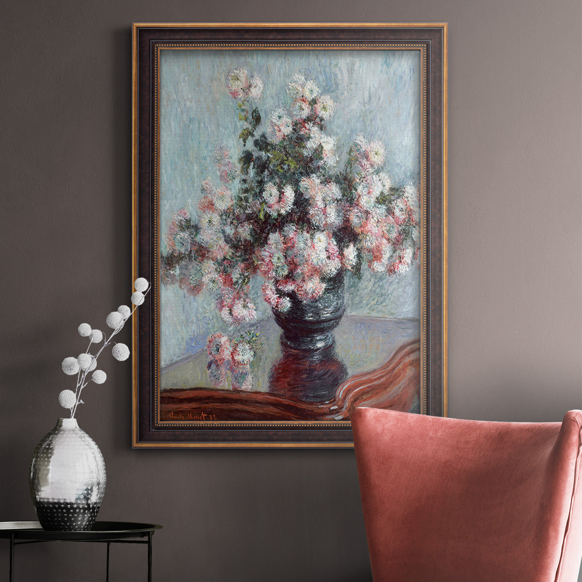 Impressionist chrysanthemum floral painting by Claude Monet in an ornate bronzed mahogany wood frame displayed in a neutral interior setting.