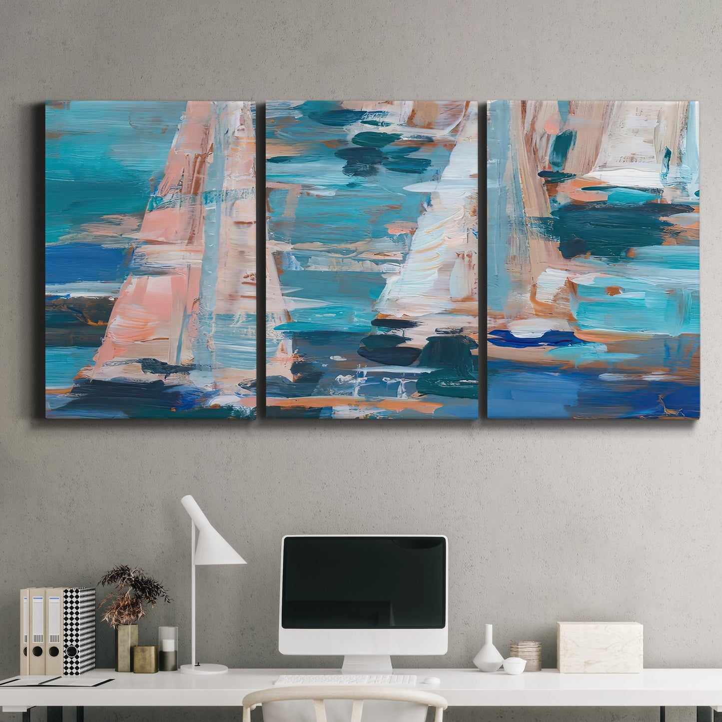 Three-panel canvas wall art featuring graphic pop style sailboats, displayed above a desk in a home office.