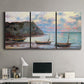 Three-panel canvas wall art featuring golden coastal sunset with cliffs, displayed above a desk in a home office.