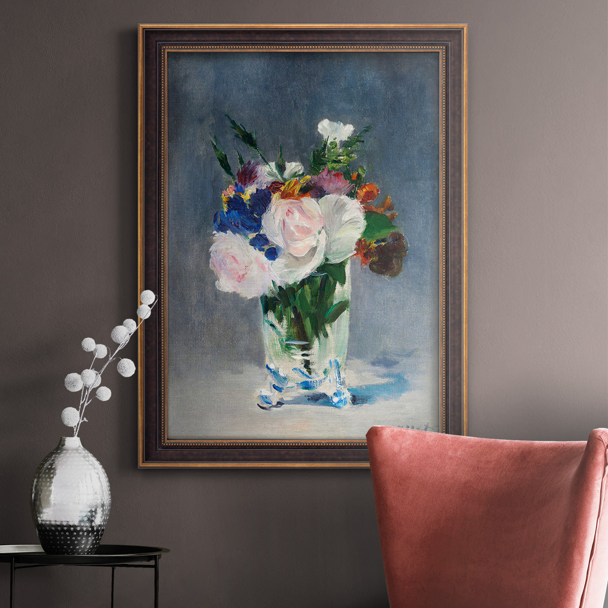 Impressionist floral still life painting by Claude Monet in an ornate bronzed mahogany wood frame displayed in a neutral interior setting.