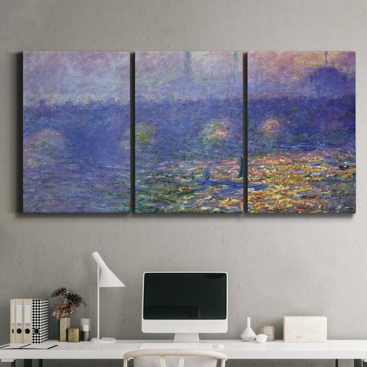 Three-panel canvas wall art featuring overcast bridge above river, displayed above a desk in a home office.