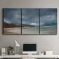 Three-panel canvas wall art featuring stormy sea glass toned coastline, displayed above a desk in a home office.