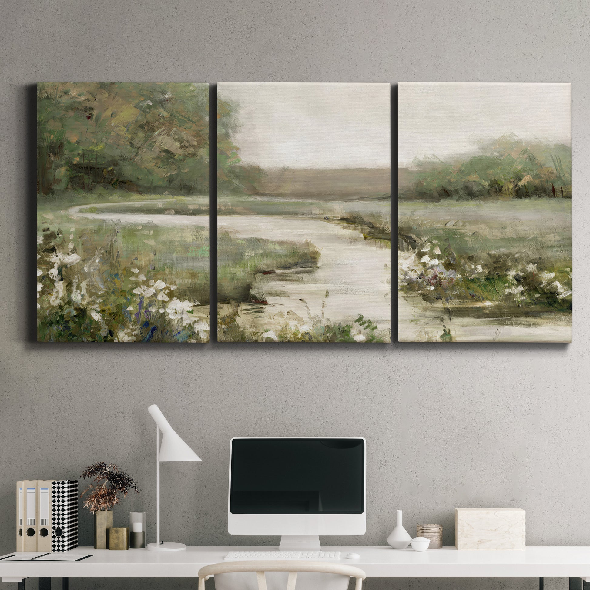 Three-panel canvas wall art featuring narrow path through quiet landscape, displayed above a desk in a home office.