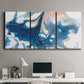 Three-panel canvas wall art featuring flowing blue abstract movement, displayed above a desk in a home office.