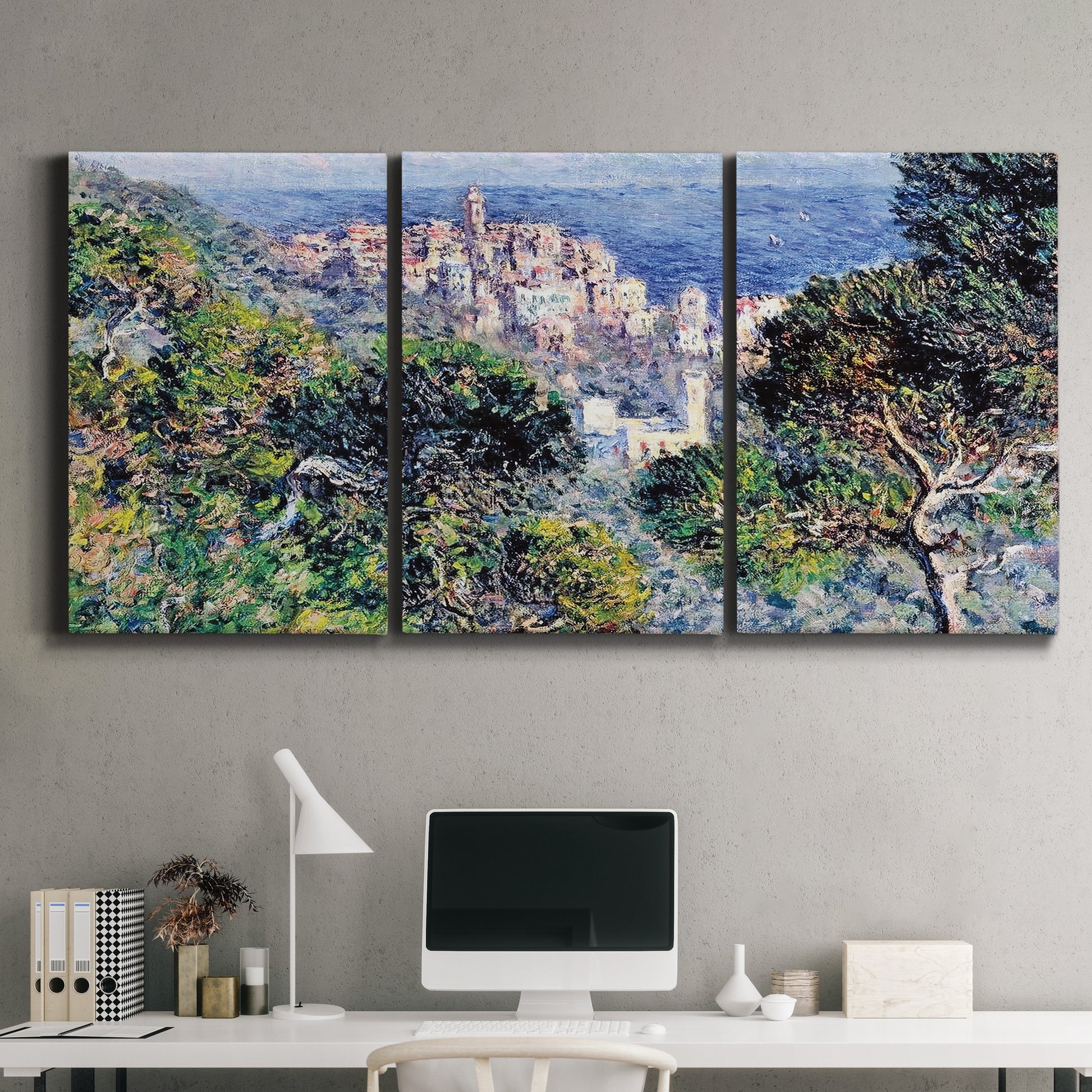 Three-panel canvas wall art featuring coastal hillside overlooking monaco, displayed above a desk in a home office.