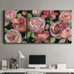 Three-panel canvas wall art featuring bold red floral abstraction, displayed above a desk in a home office.