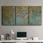 Three-panel canvas wall art featuring earthy copper toned abstract, displayed above a desk in a home office.