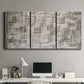 Three-panel canvas wall art featuring grid based geometric abstraction, displayed above a desk in a home office.