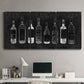 Three-panel canvas wall art featuring illustrated wine bottle cellar diagram, displayed above a desk in a home office.