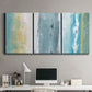 Three-panel canvas wall art featuring abstract coastal shoreline textures, displayed above a desk in a home office.