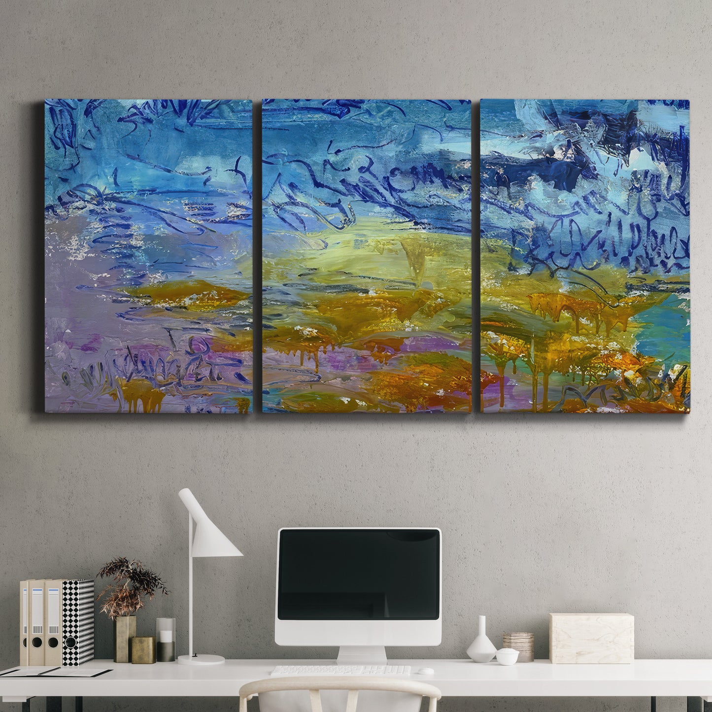 Three-panel canvas wall art featuring expressive abstract with layered color, displayed above a desk in a home office.