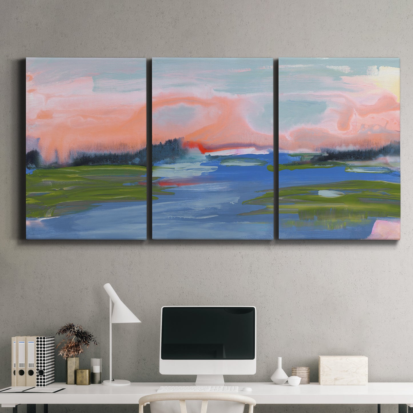Three-panel canvas wall art featuring sunset reflections across calm sea, displayed above a desk in a home office.
