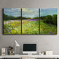 Three-panel canvas wall art featuring pastoral field with wildflowers, displayed above a desk in a home office.