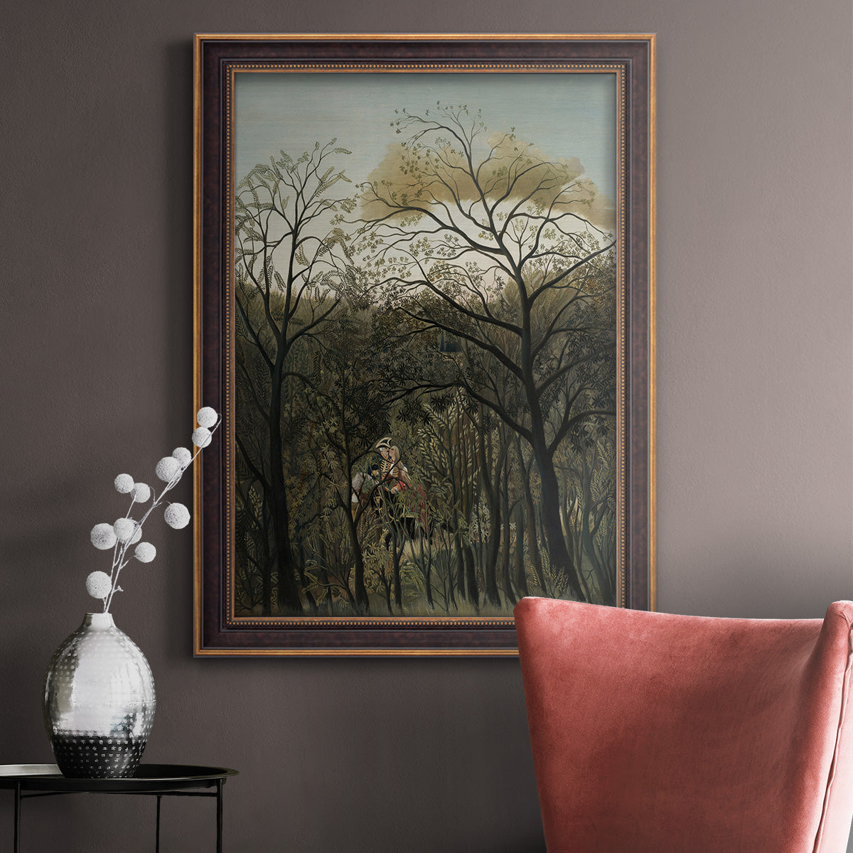Dreamlike forest landscape scene by Henri Rousseau in an ornate bronzed mahogany wood frame displayed in a neutral interior setting.