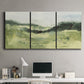 Three-panel canvas wall art featuring rolling hillside countryside landscape, displayed above a desk in a home office.