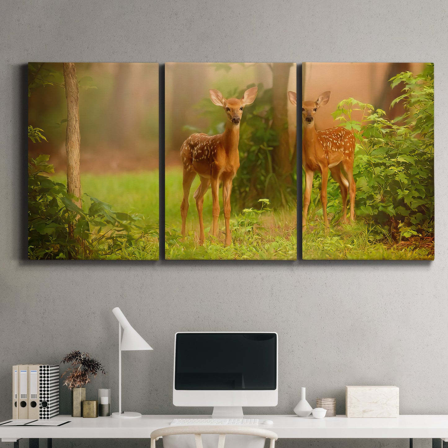 Three-panel canvas wall art featuring resting animals in open field, displayed above a desk in a home office.