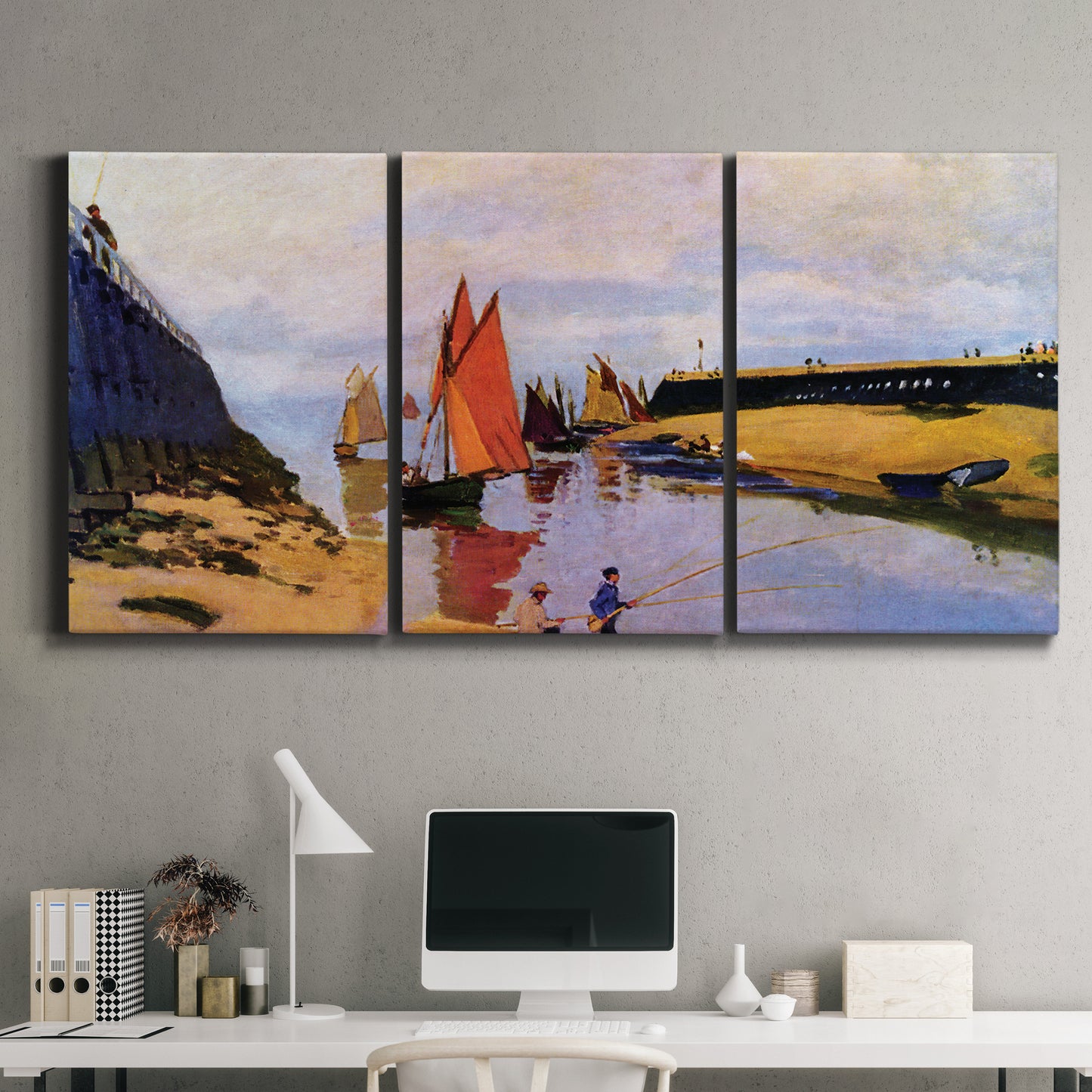 Three-panel canvas wall art featuring stone breakwater at low tide, displayed above a desk in a home office.