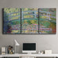 Three-panel canvas wall art featuring water lilies with arched bridge, displayed above a desk in a home office.